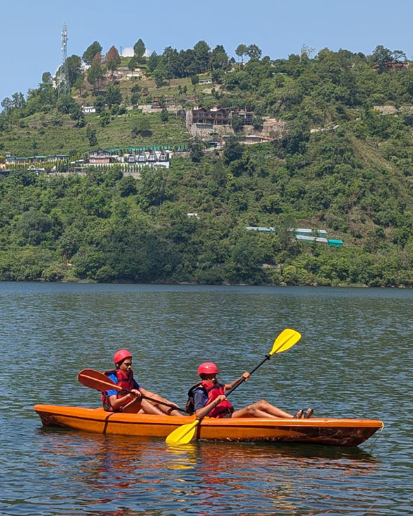 Two people kayaking on clear water