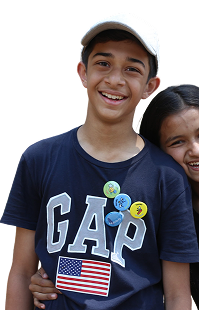 Smiling camper in a blue GAP t-shirt and white cap
